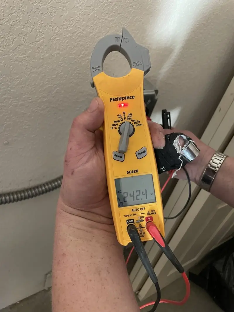 Voltage testing with clamp meter during Outlet Installation in Lower Providence